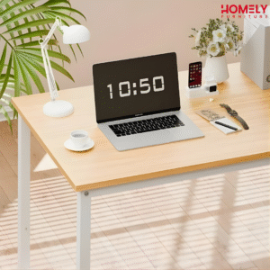 Homely SunGlow Minimal Desk A modern workstation setup featuring the Homely SunGlow Desk with a sleek white powder-coated metal base and ample legroom. The 30-inch high wooden desk surface is paired with tall overhead shelves, showcasing a minimalist design that maximizes vertical storage space in compact studios or bedrooms.